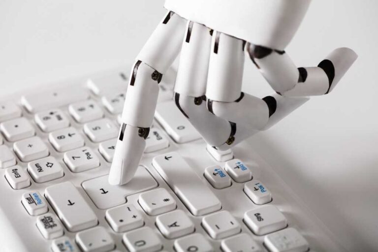 robotic hand typing on keyboard