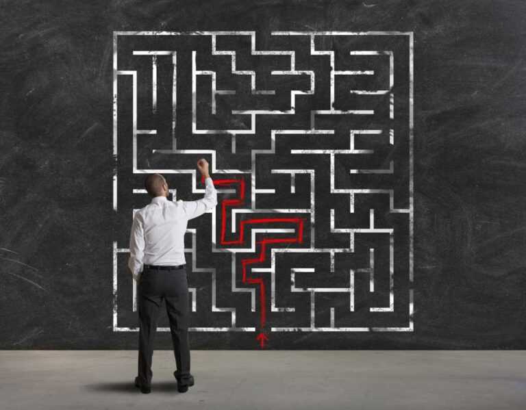 Complexity, problem solving. Man solves a maze.